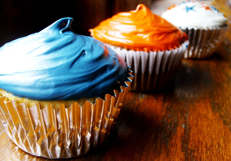 Colorful cupcakes on wood