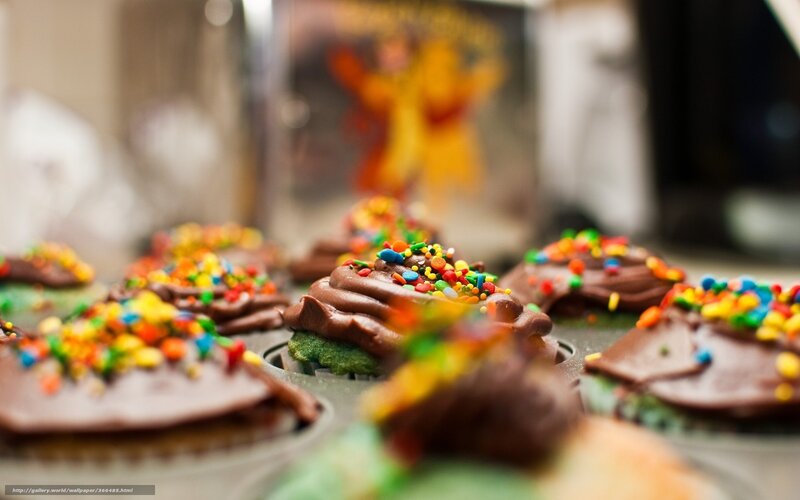 Colorful cupcakes with chocolate frosting