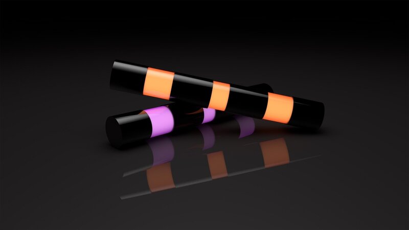 Colorful cylinders on black surface