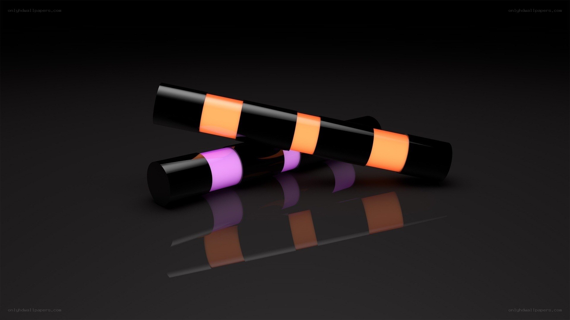Colorful cylinders on black surface