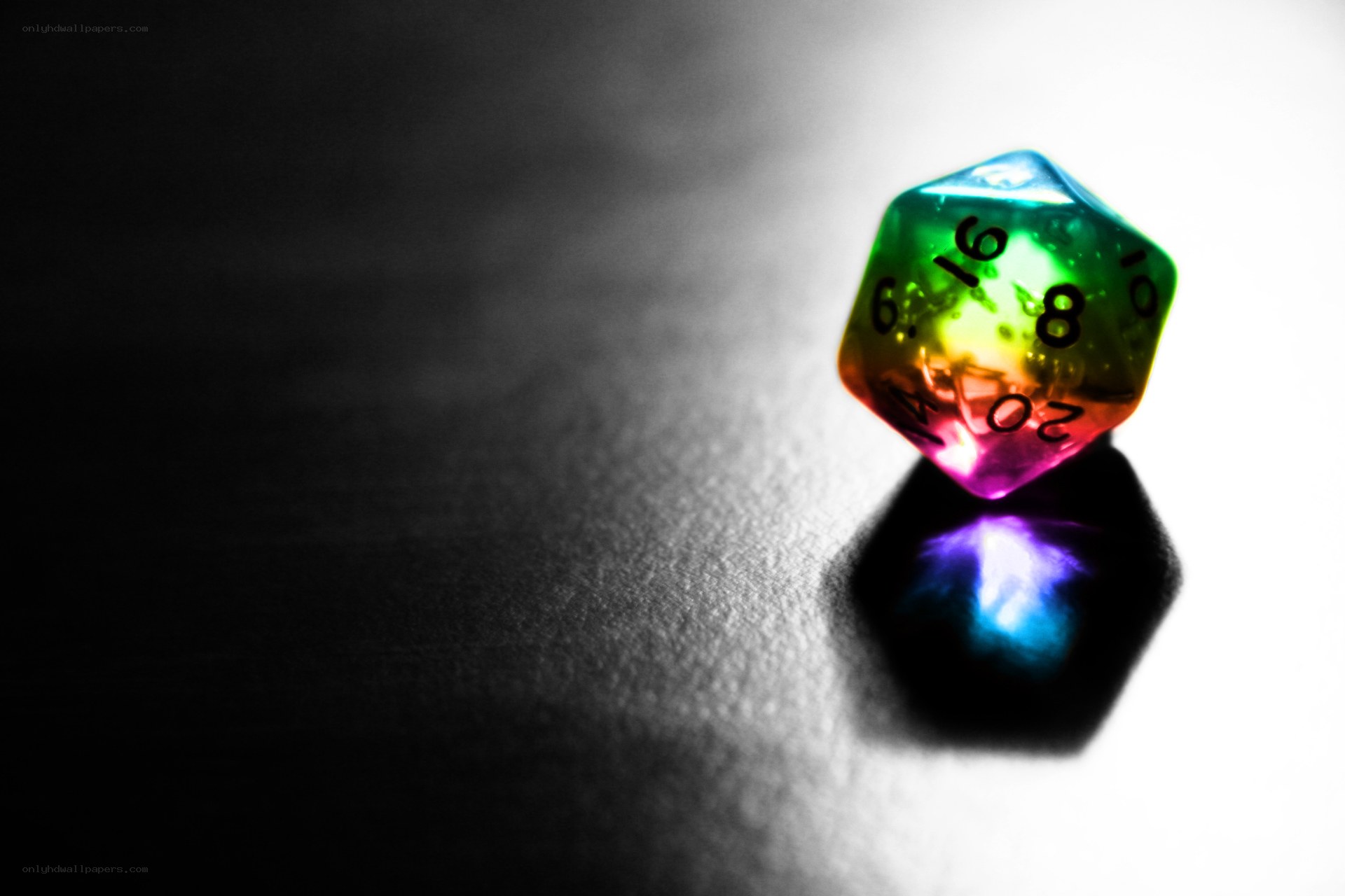 Colorful dice on dark surface