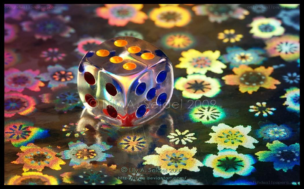 Colorful dice on floral surface