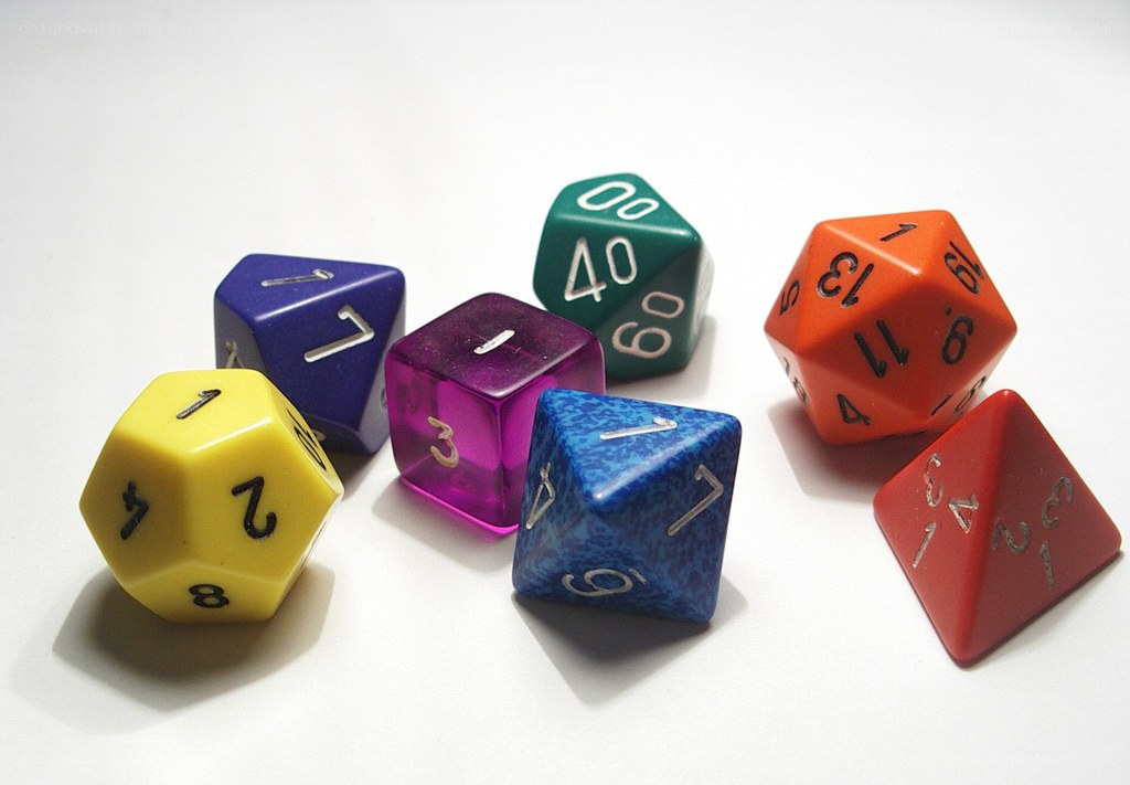 Colorful dice on white surface