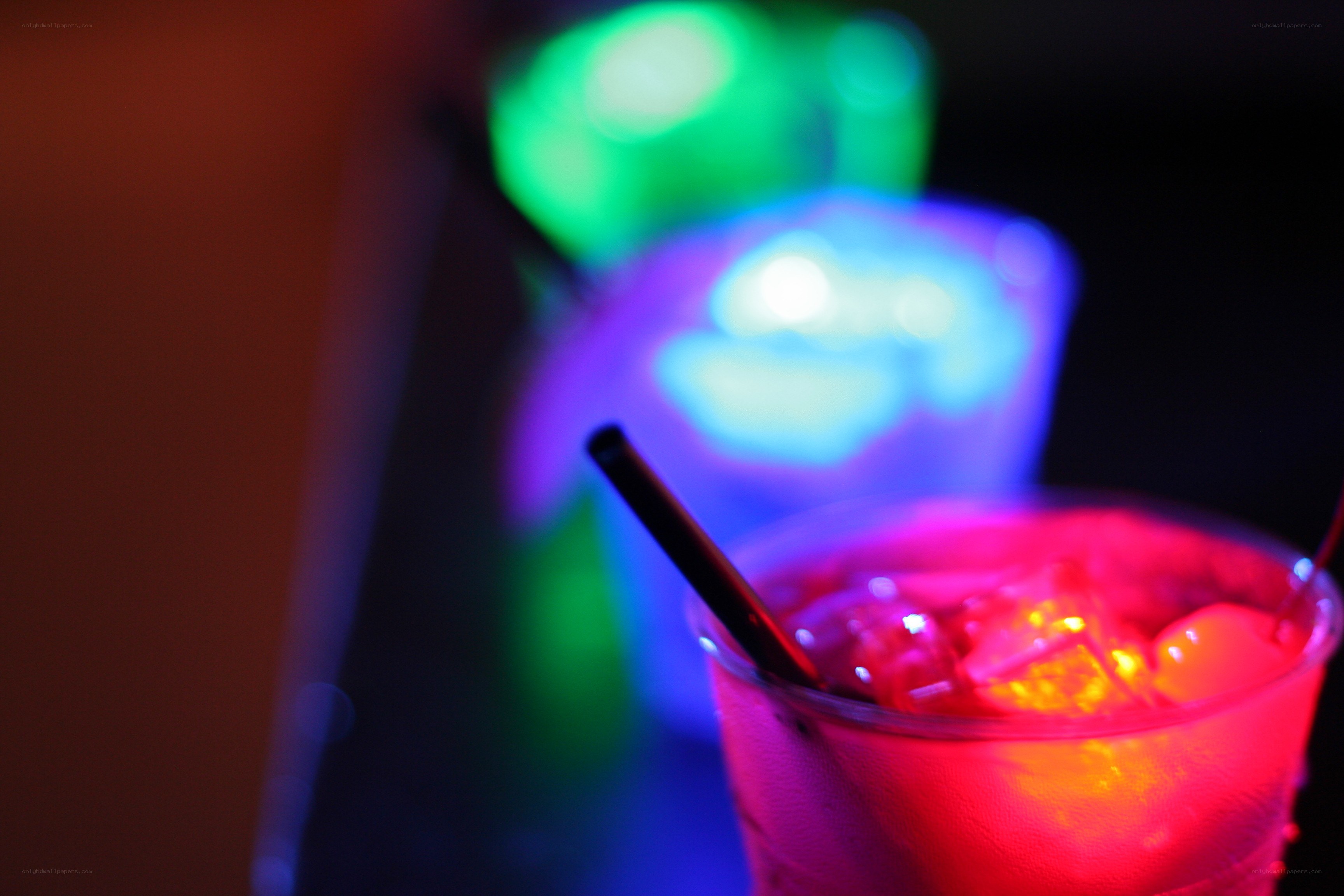 Colorful drinks in a dark setting