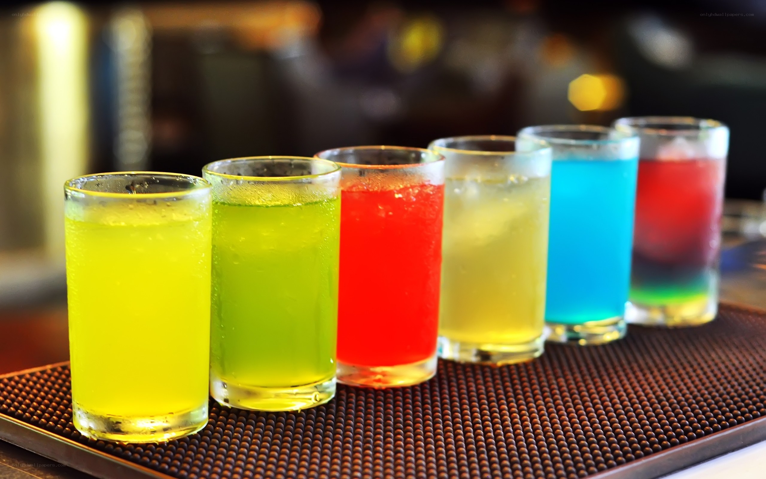 Colorful drinks on bar mat