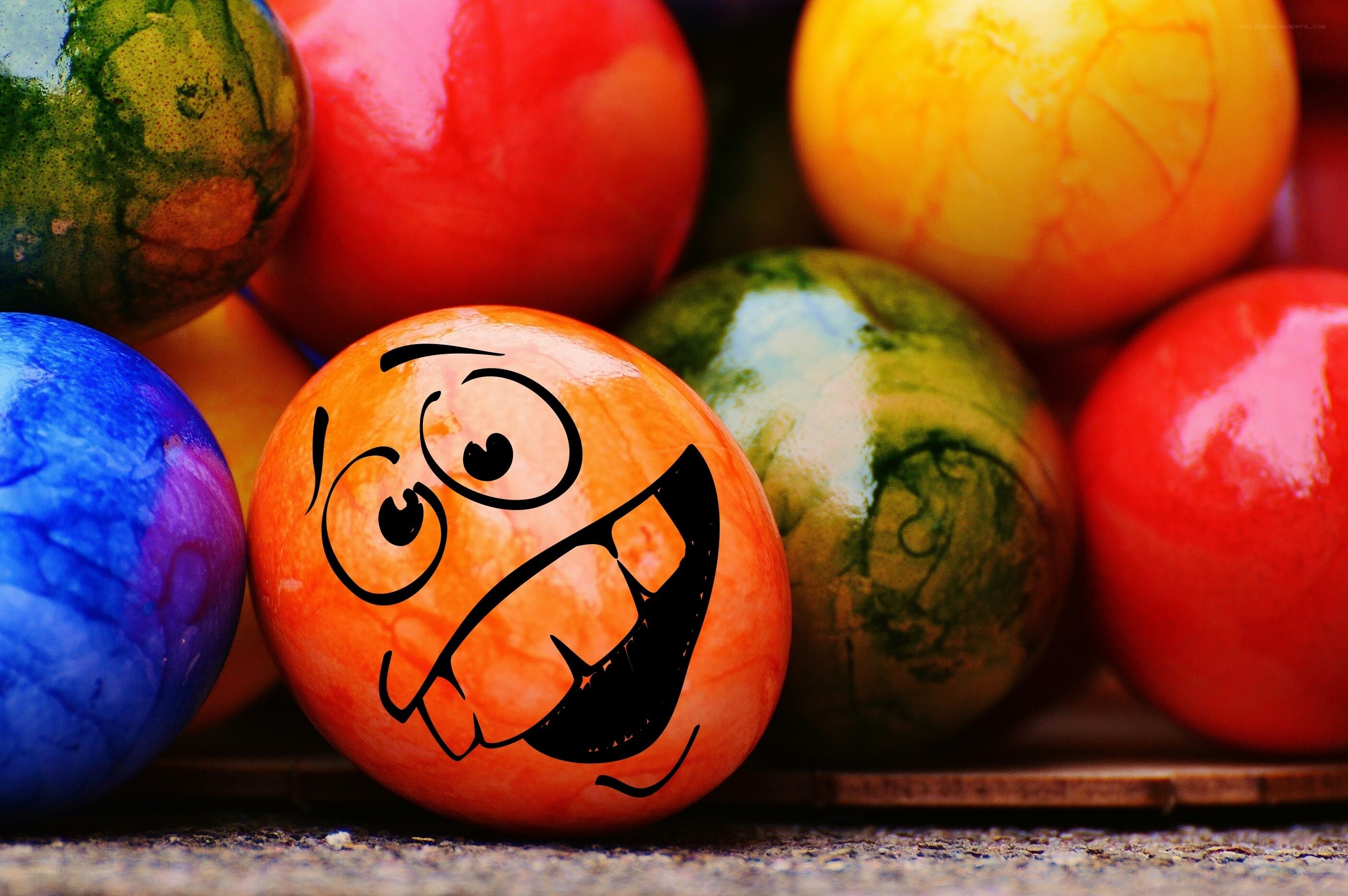 Colorful Easter eggs with cartoon face