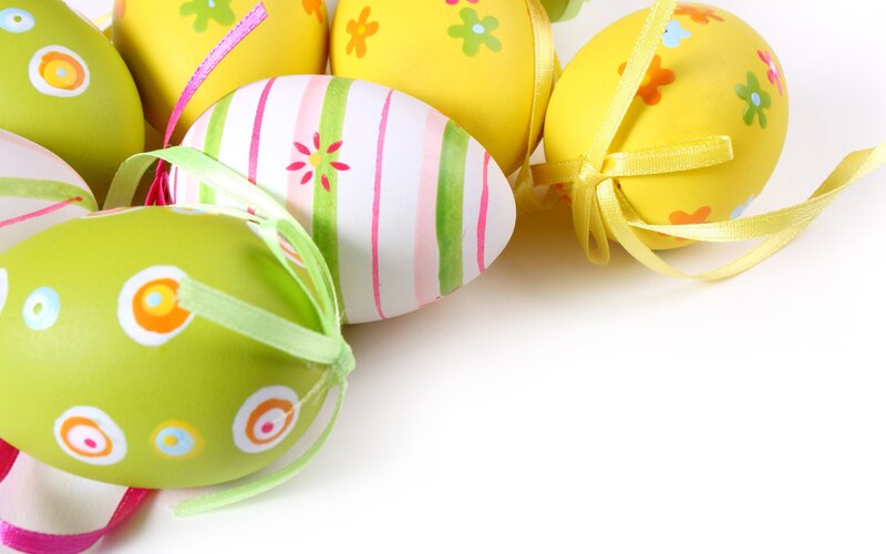 Colorful Easter eggs with ribbons