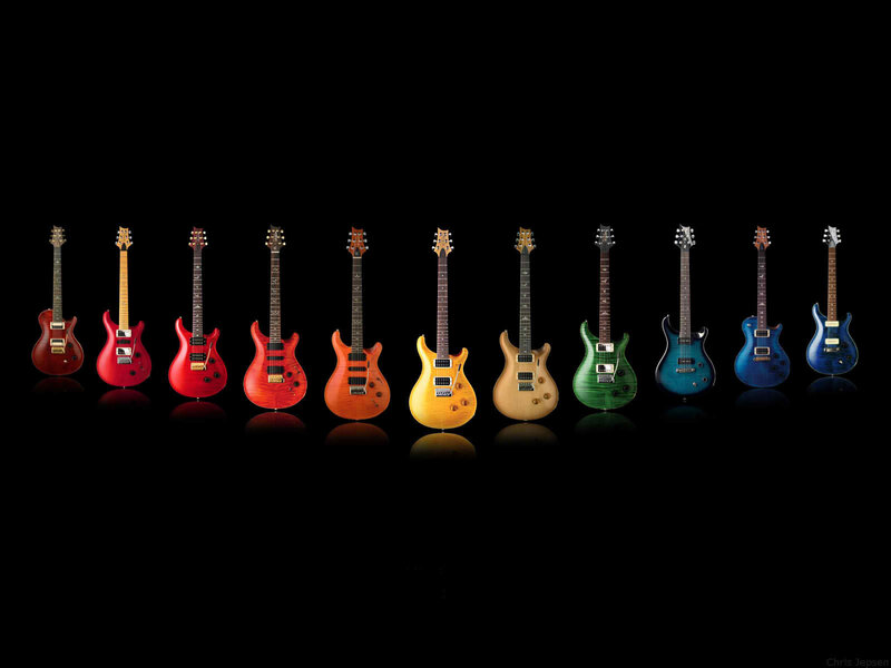 Colorful electric guitars in a row