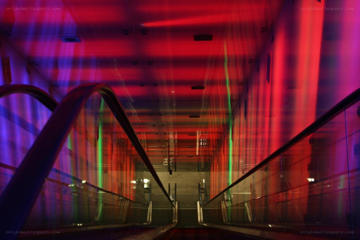 Colorful escalator tunnel