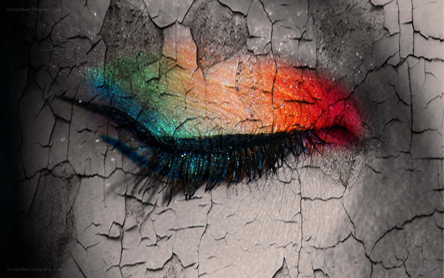 colorful eye makeup on cracked surface