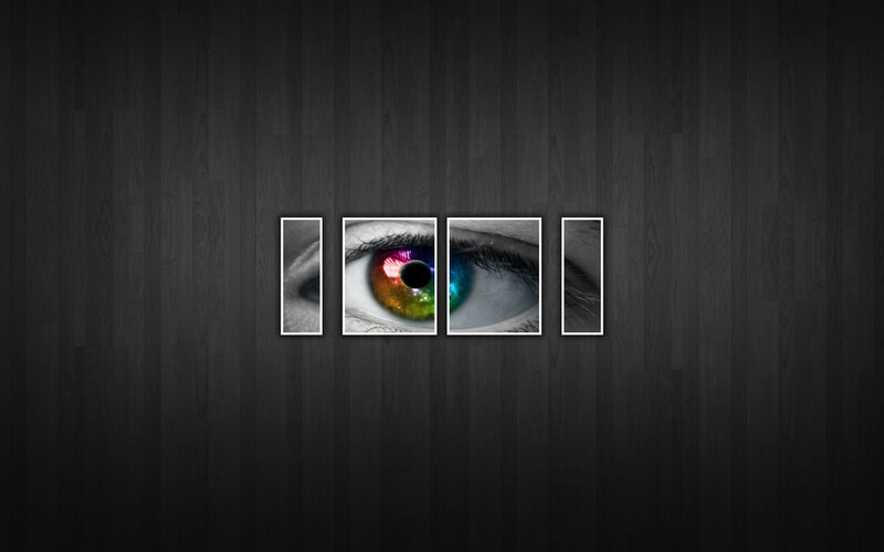 colorful eye on dark wood
