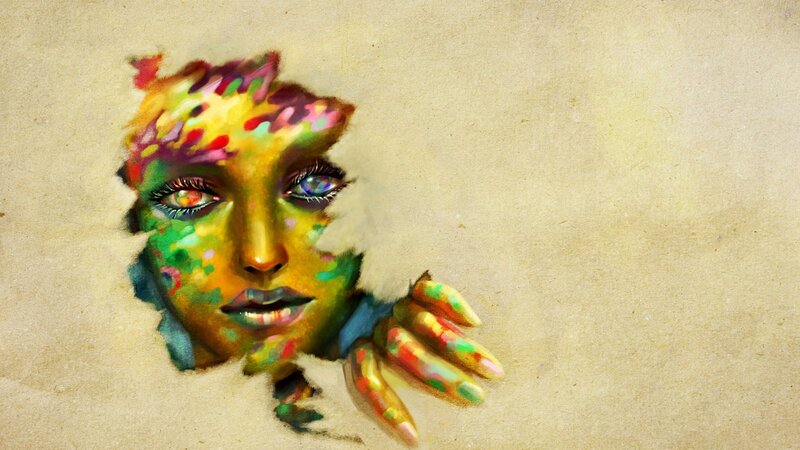 colorful face emerging from paper
