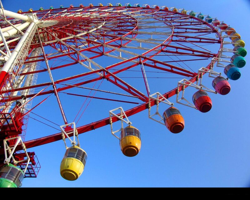 Colorful Ferris Wheel Against Blue Sky