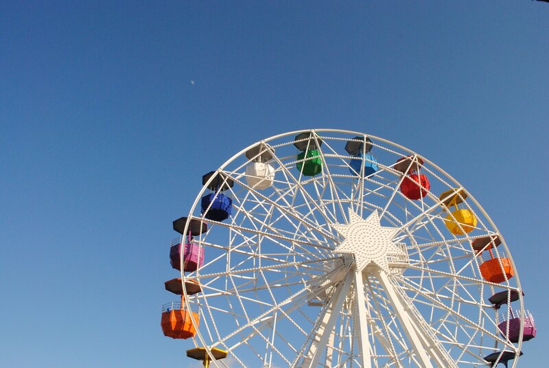 Colorful Ferris Wheel Against Blue Sky