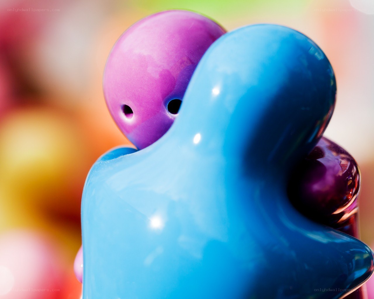 Colorful figurines hugging