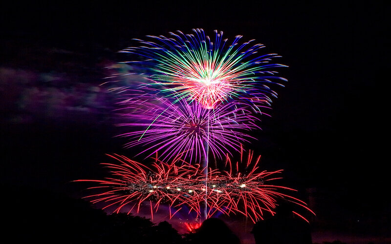 Colorful Fireworks Display — Red, Festive, Night, Photograph, Sky, Silhouettes