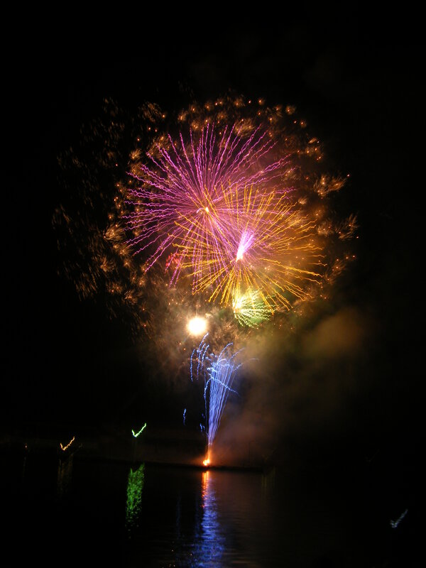 Colorful fireworks over water