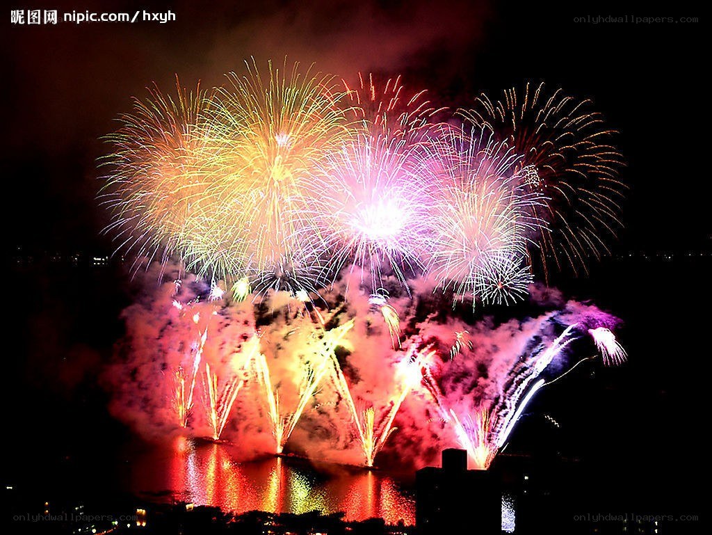 Colorful fireworks over water