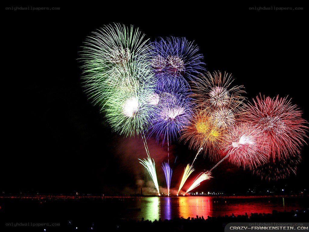 Colorful fireworks over water