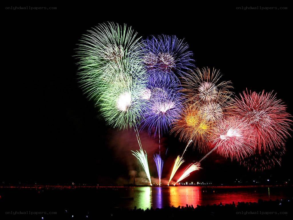 Colorful fireworks over water