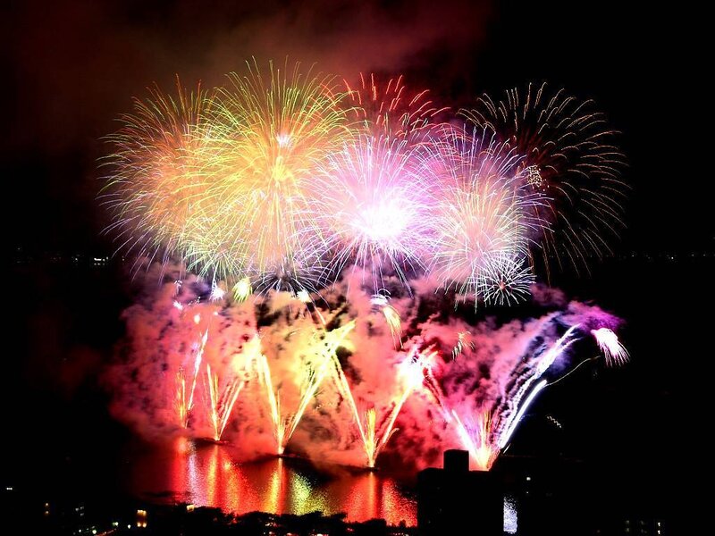Colorful fireworks over water
