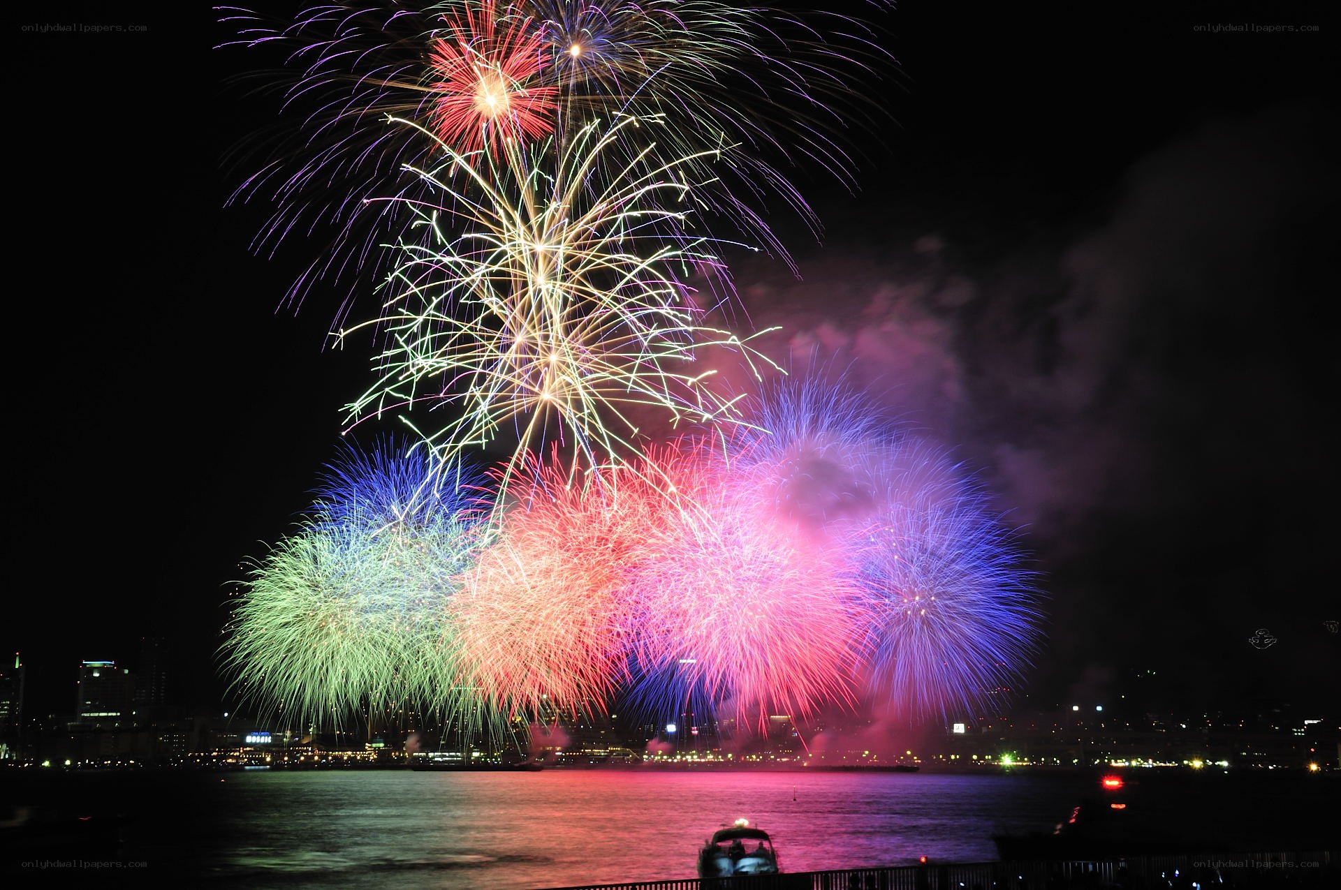 Colorful fireworks over water