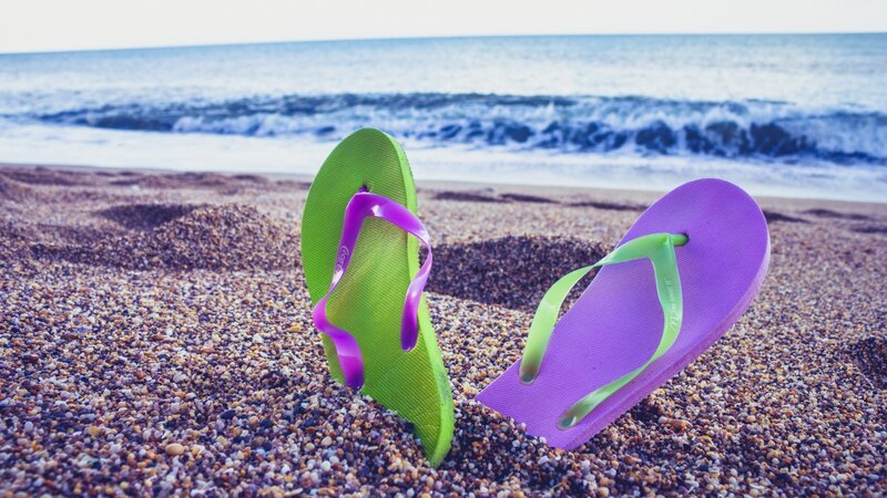 Colorful Flip-flops on Beach — Green