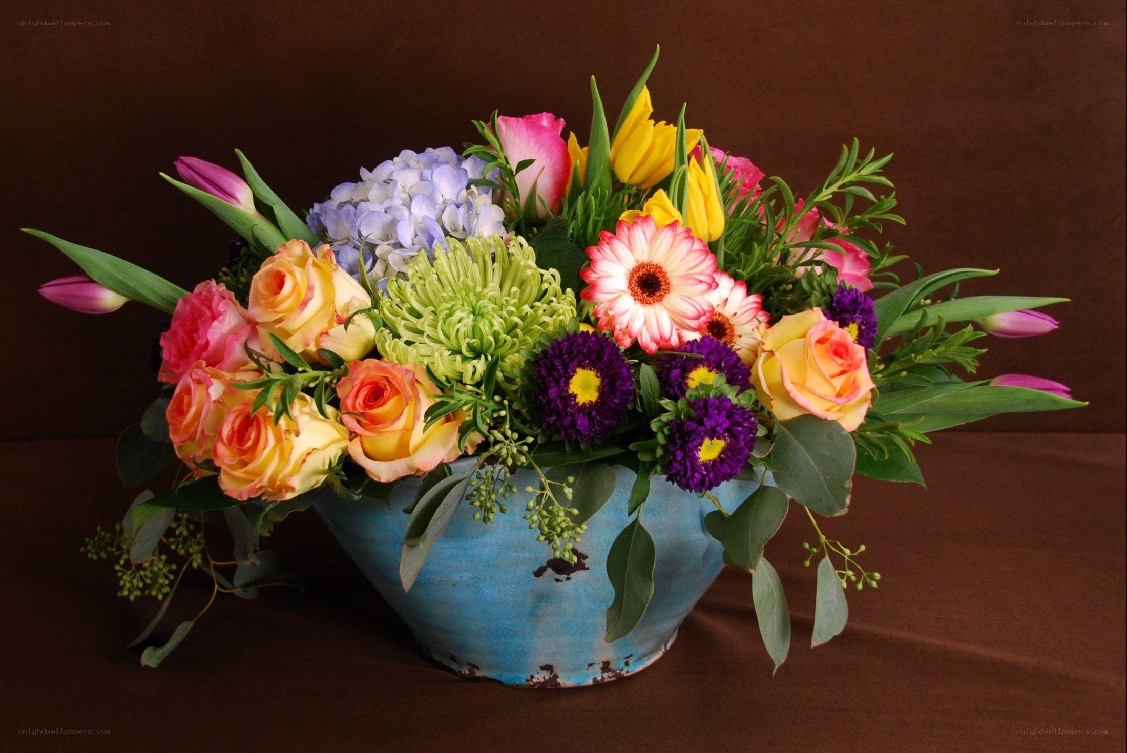 Colorful flower arrangement in blue vase