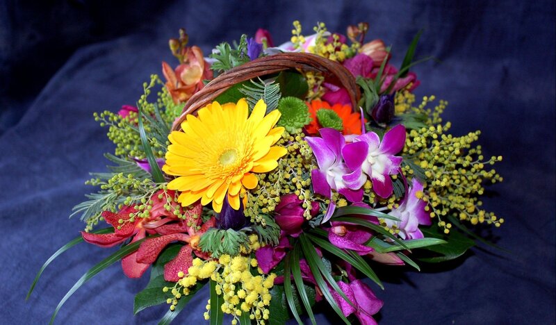 Colorful flower bouquet in basket