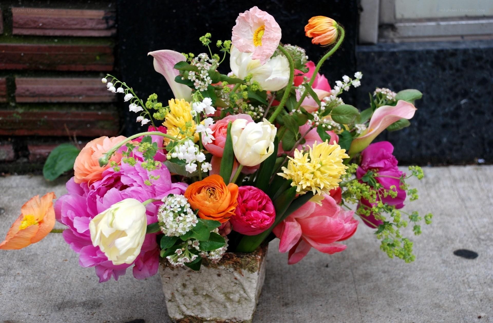 Colorful flower bouquet on sidewalk