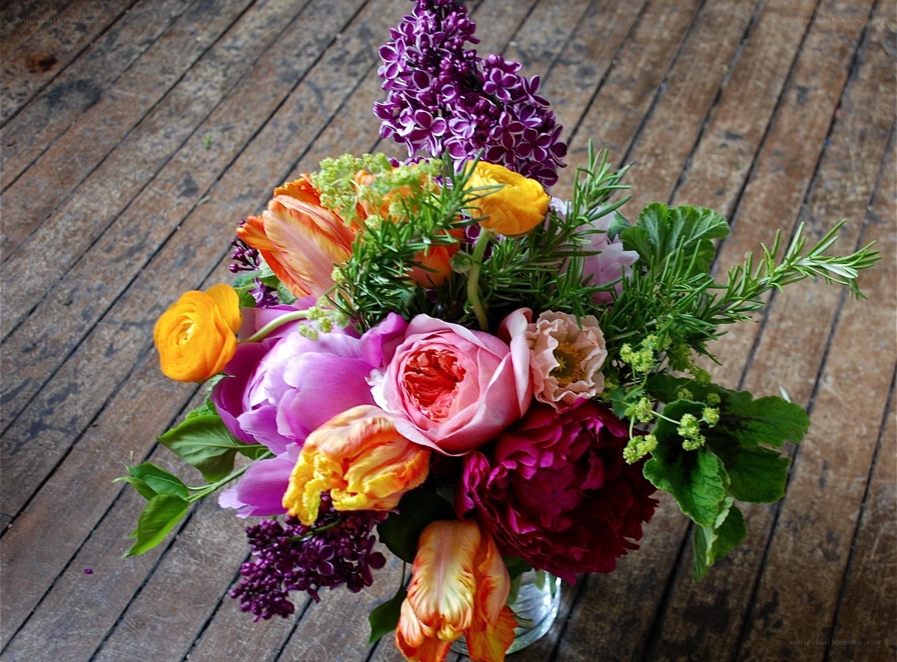 Colorful flower bouquet on wood