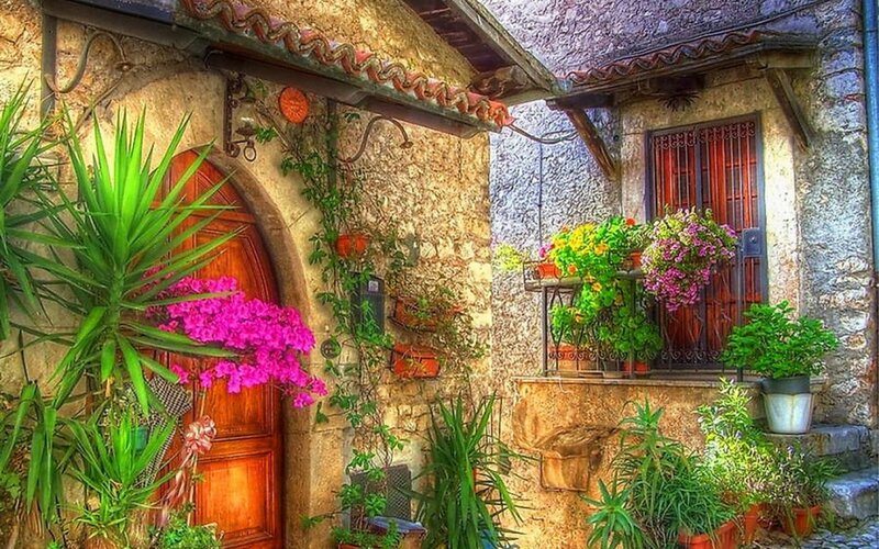 colorful garden at stone house