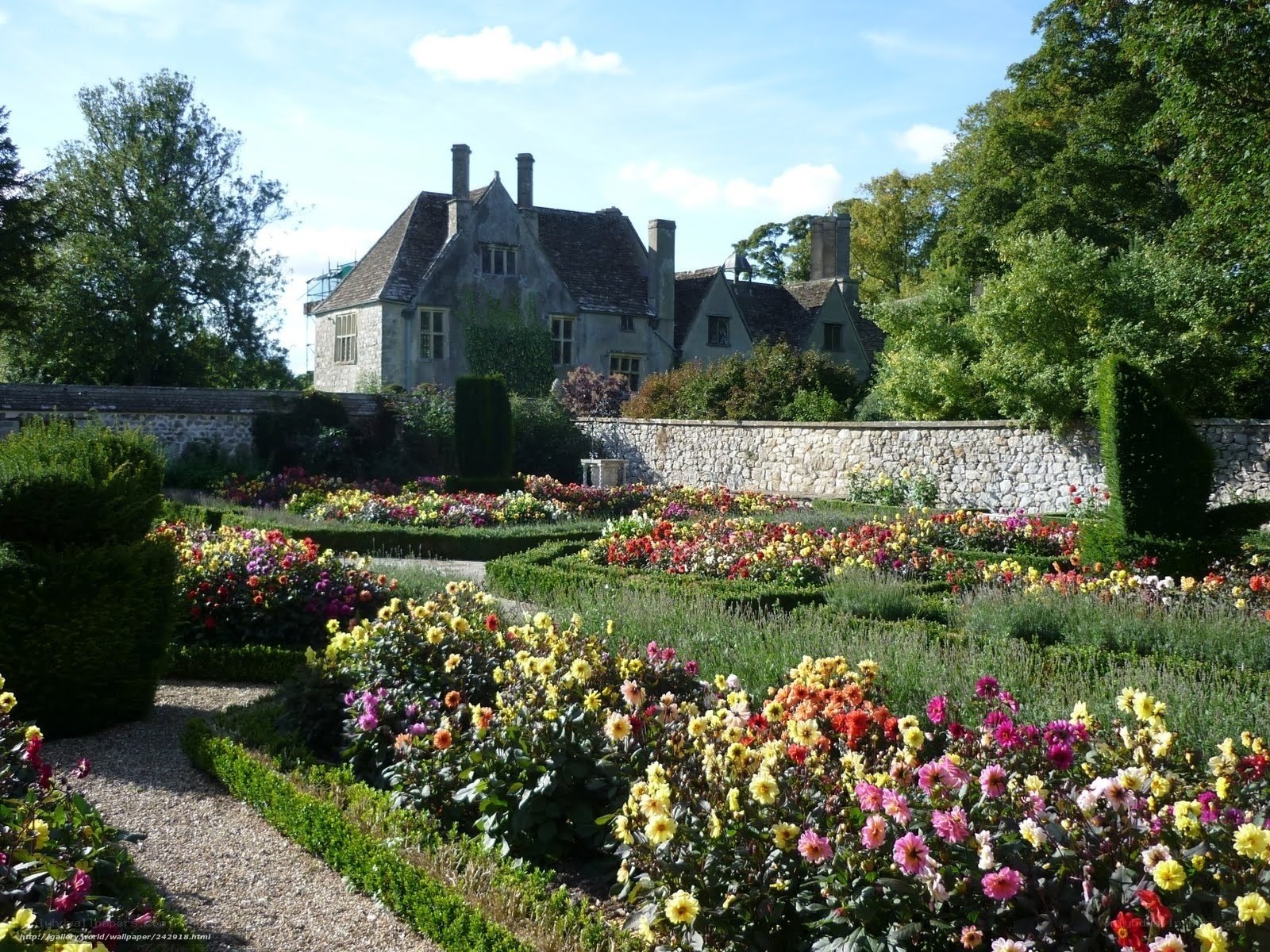 Colorful garden with stone house