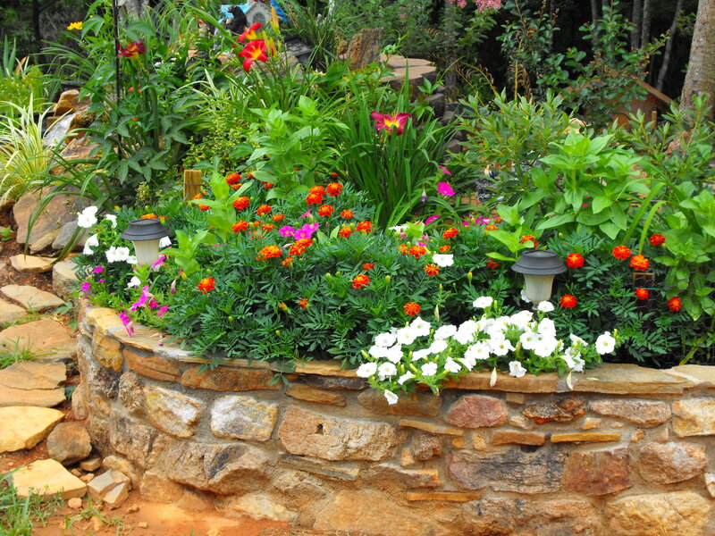 Colorful garden with stone wall