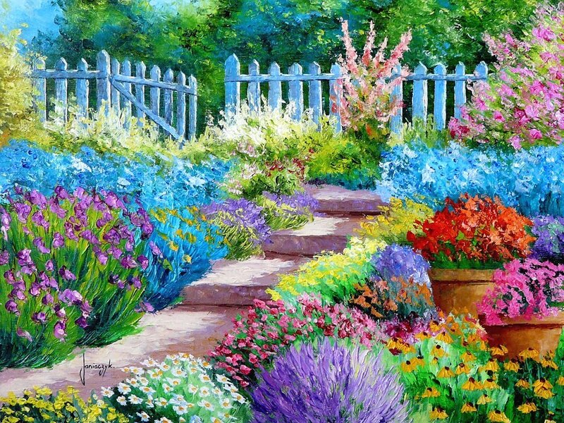 Colorful garden with white fence