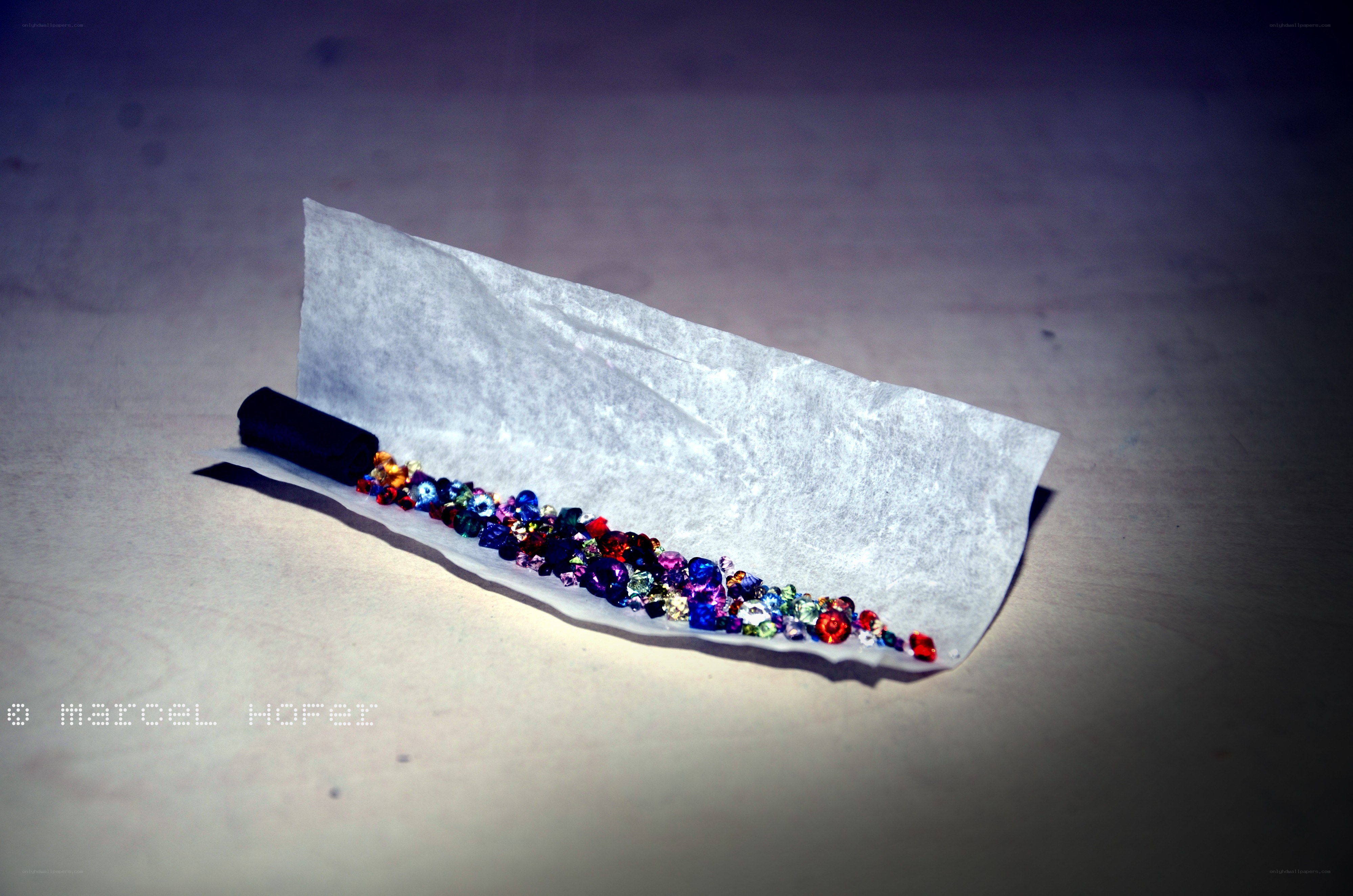 Colorful gems on paper