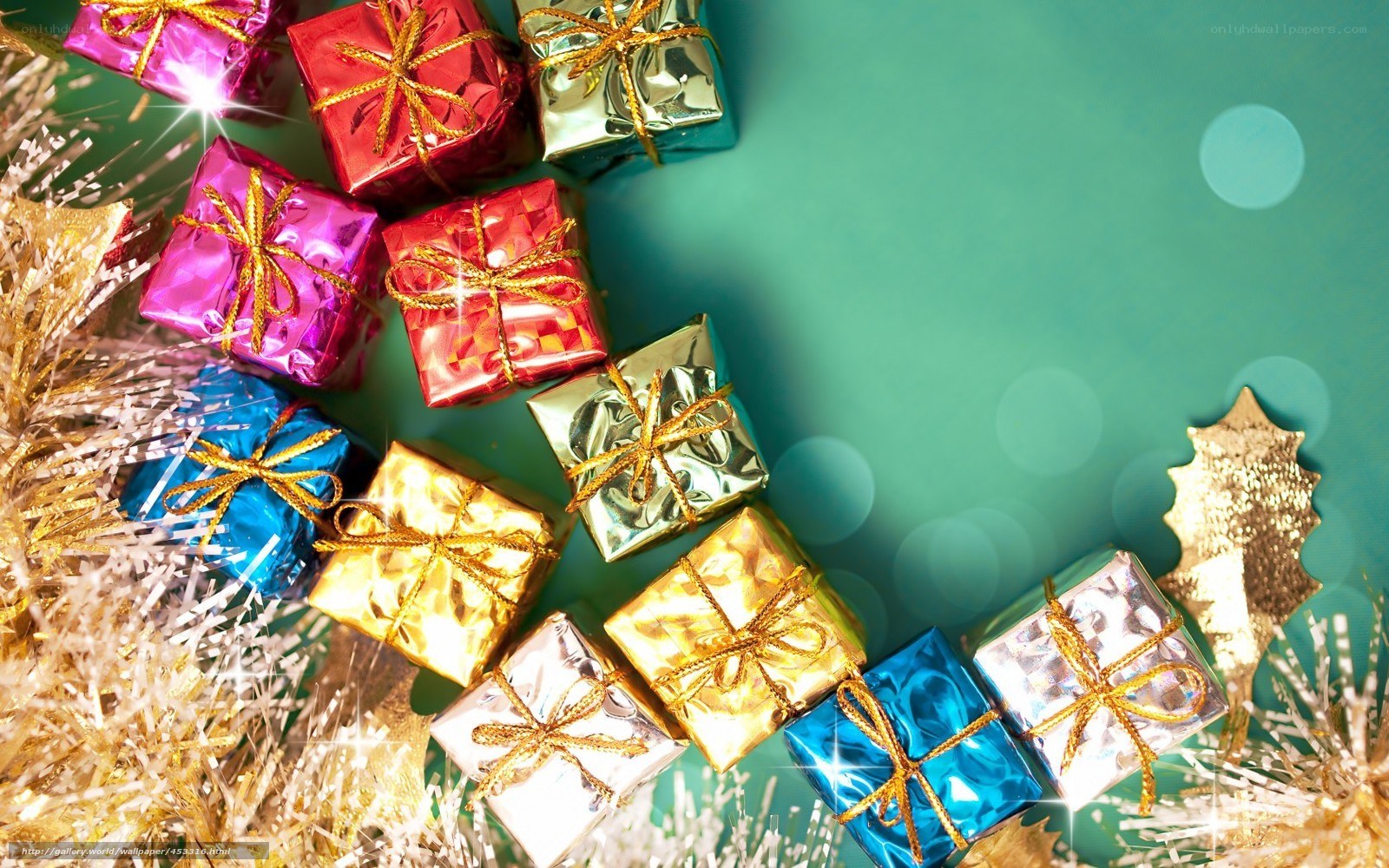 Colorful gift boxes on green