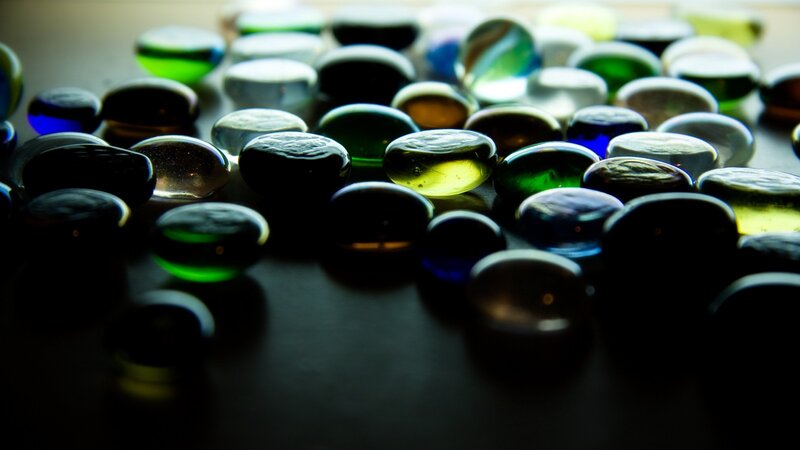 Colorful glass beads scattered