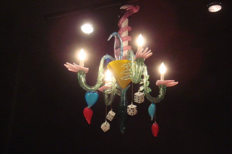 Colorful glass chandelier with hands