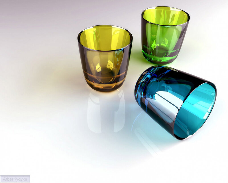 Colorful glass cups on white