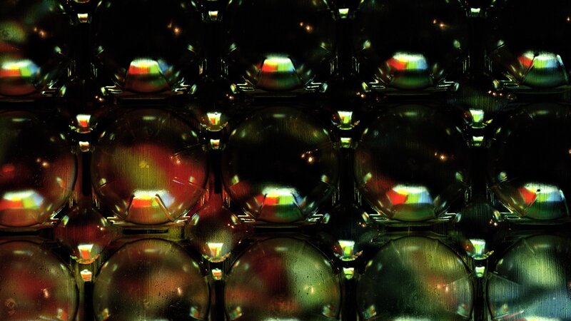 Colorful glass spheres in dark setting