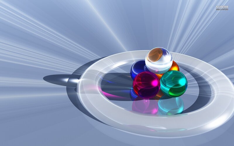 Colorful glass spheres on a plate