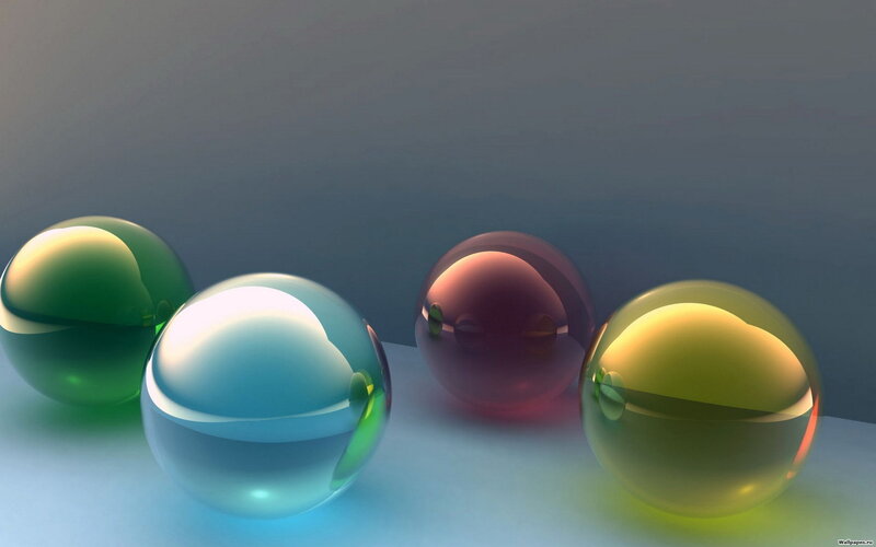 Colorful glass spheres on blue