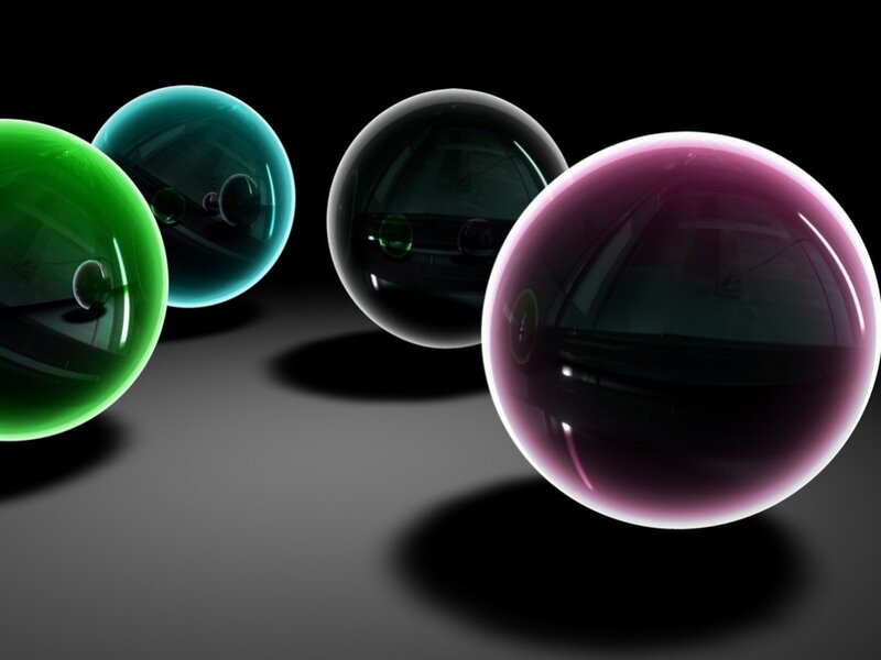 Colorful glass spheres on dark surface