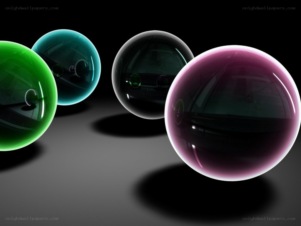 Colorful glass spheres on dark surface