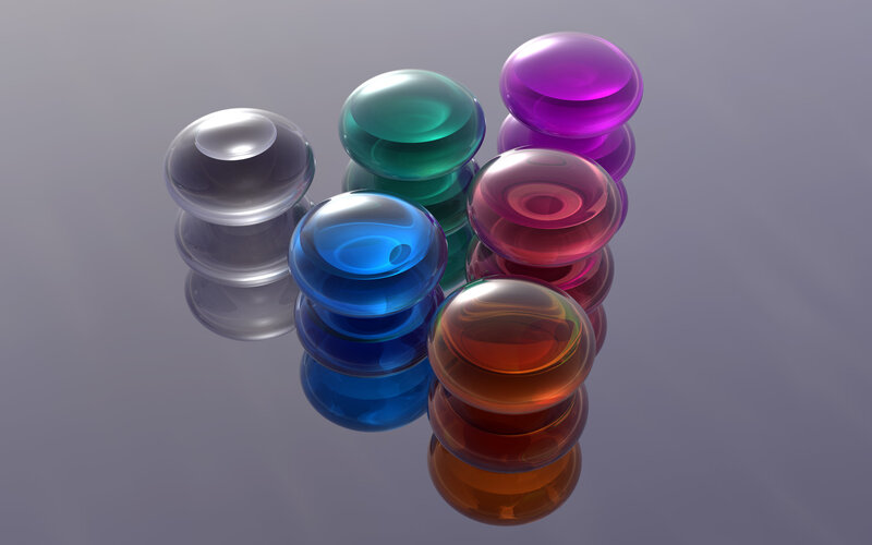 Colorful glass spheres on reflective surface
