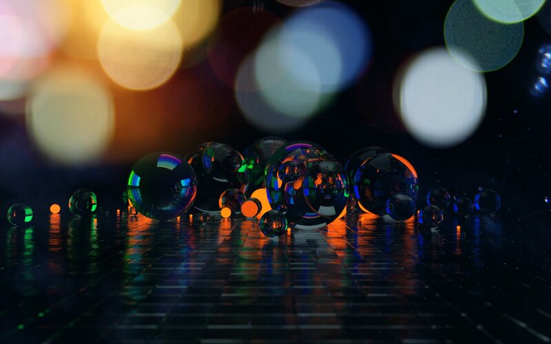 Colorful glass spheres on reflective surface