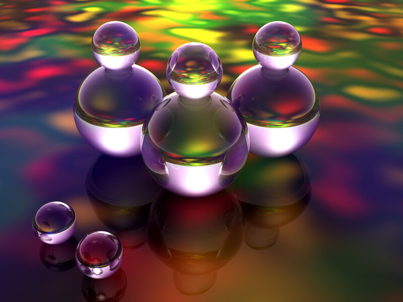 Colorful glass spheres on reflective surface