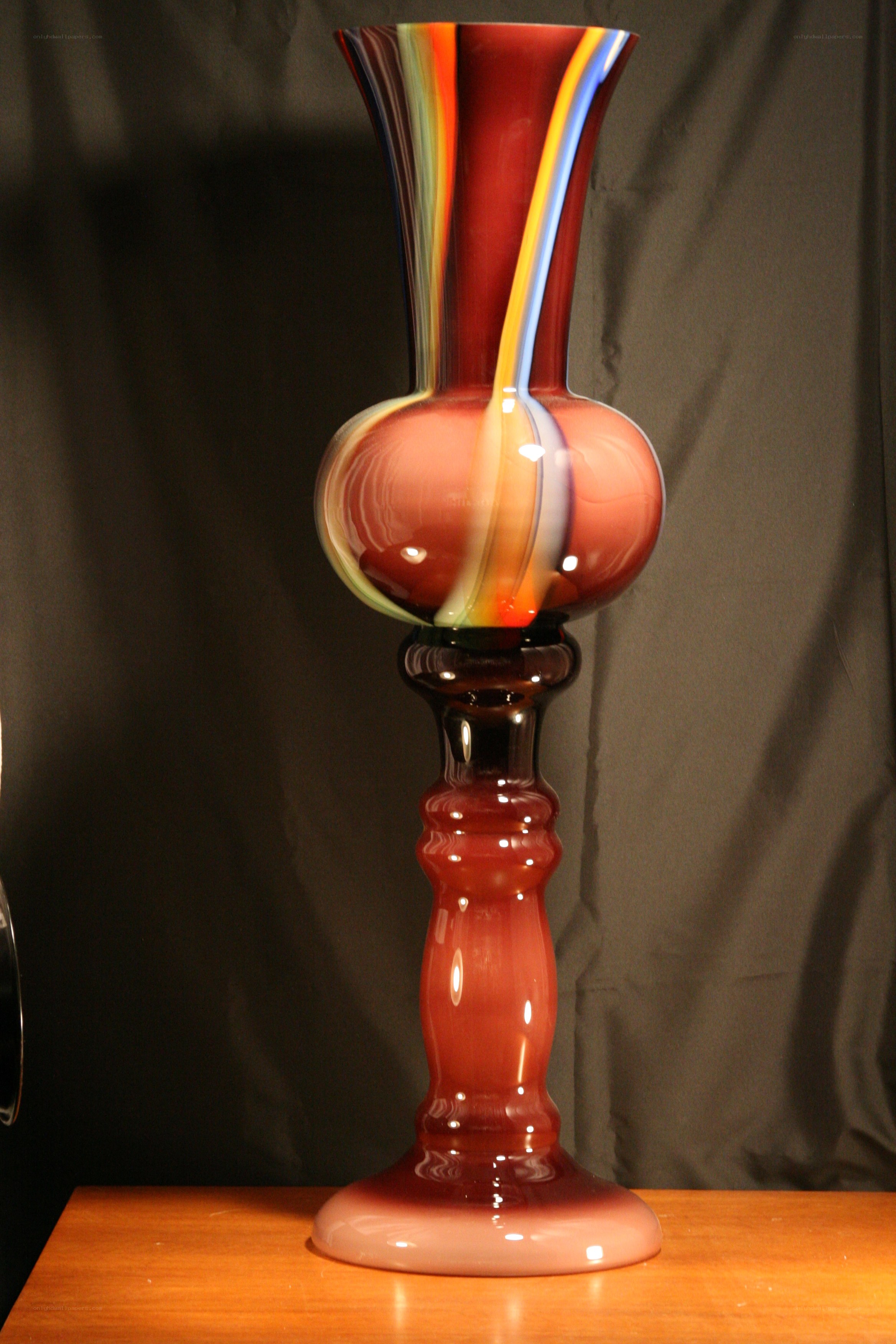 Colorful glass vase on stand