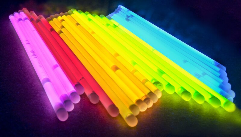 Colorful glow sticks arranged in rainbow